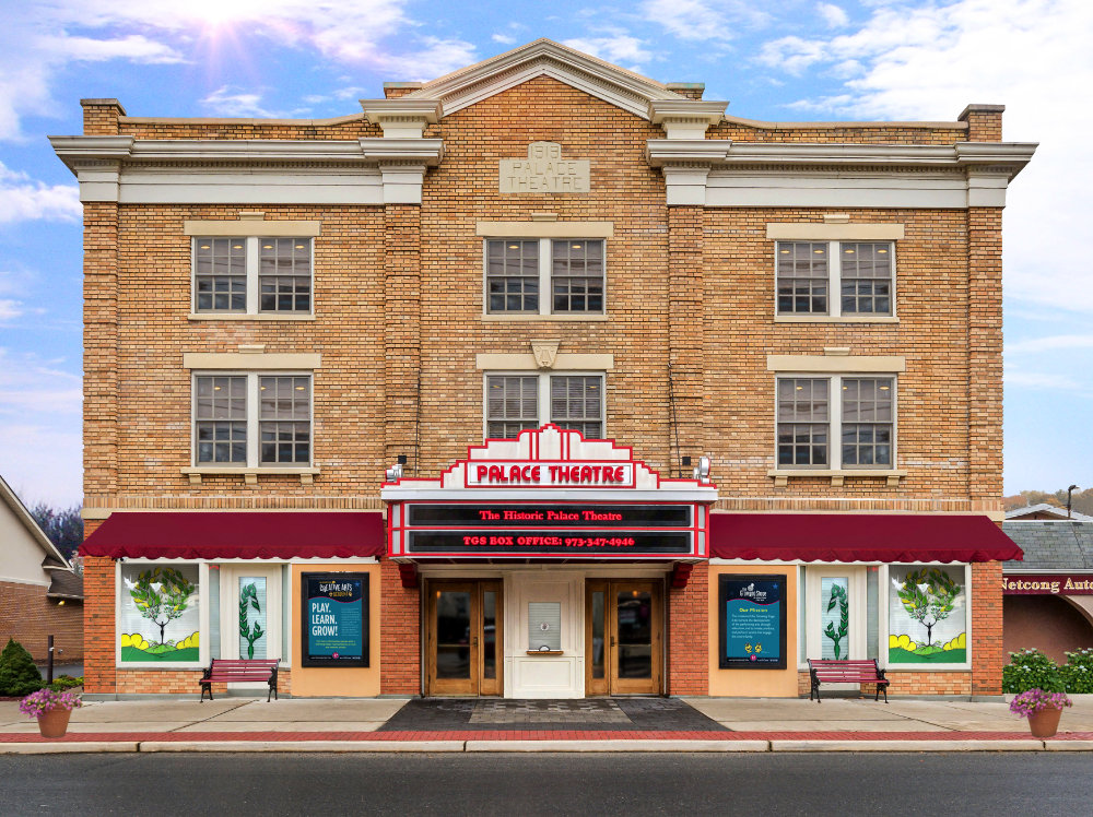 A historic brick building that says "Palace Theatre"